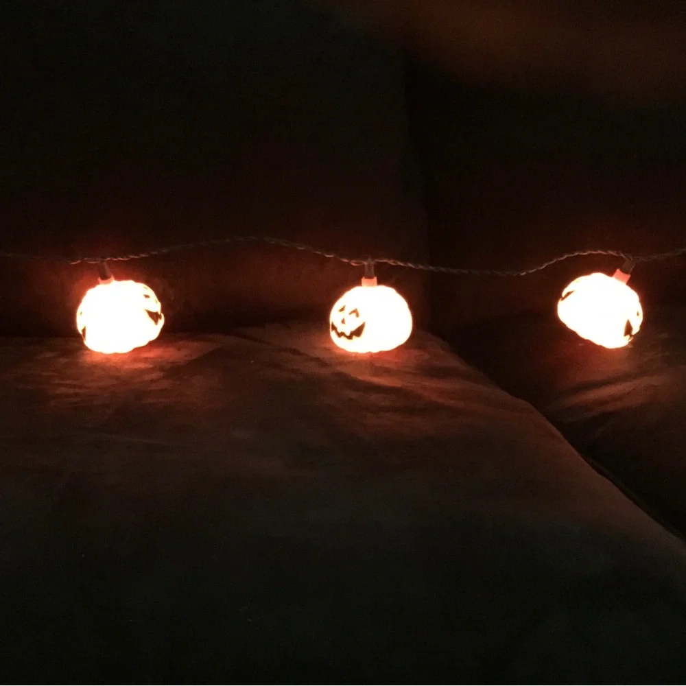 Halloween stein lights. Plastic 9’ long . 10 pumpkin lights on string.